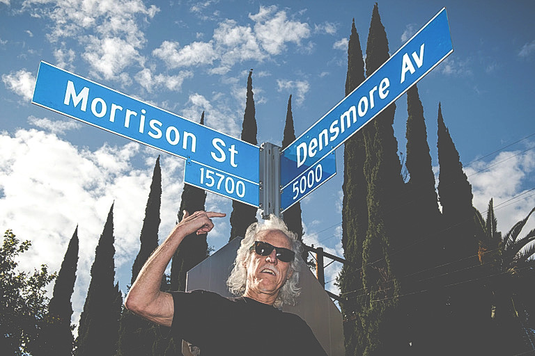 John Densmore shows the new street sign during The second annual ÒDay Of The DoorsÓ event in Encino on Thursday, Jan. 4, 2018. Los Angeles City Councilmember Paul Koretz unveils an intersecting street signs for Morrison Street and Densmore Avenue in Encino, in honor of founding band members Jim Morrison and John Densmore. (Photo by Ed Crisostomo, Los Angeles Daily News/SCNG)