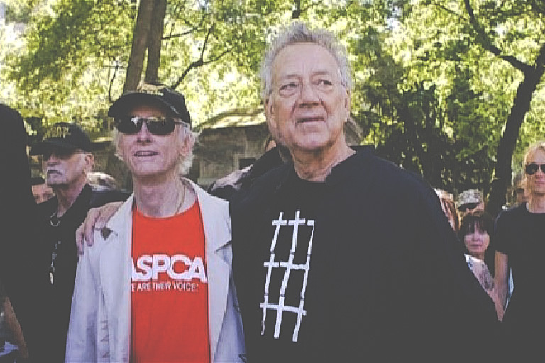 The Doors' keyboard player Manzarek and guitarist Krieger leave after visiting the grave of lead singer Morrison at the Pere Lachaise Cemetery in Paris. CREDIT: Photo: Reuters